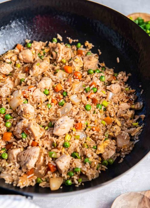 Chicken fried rice in a cast iron skillet.